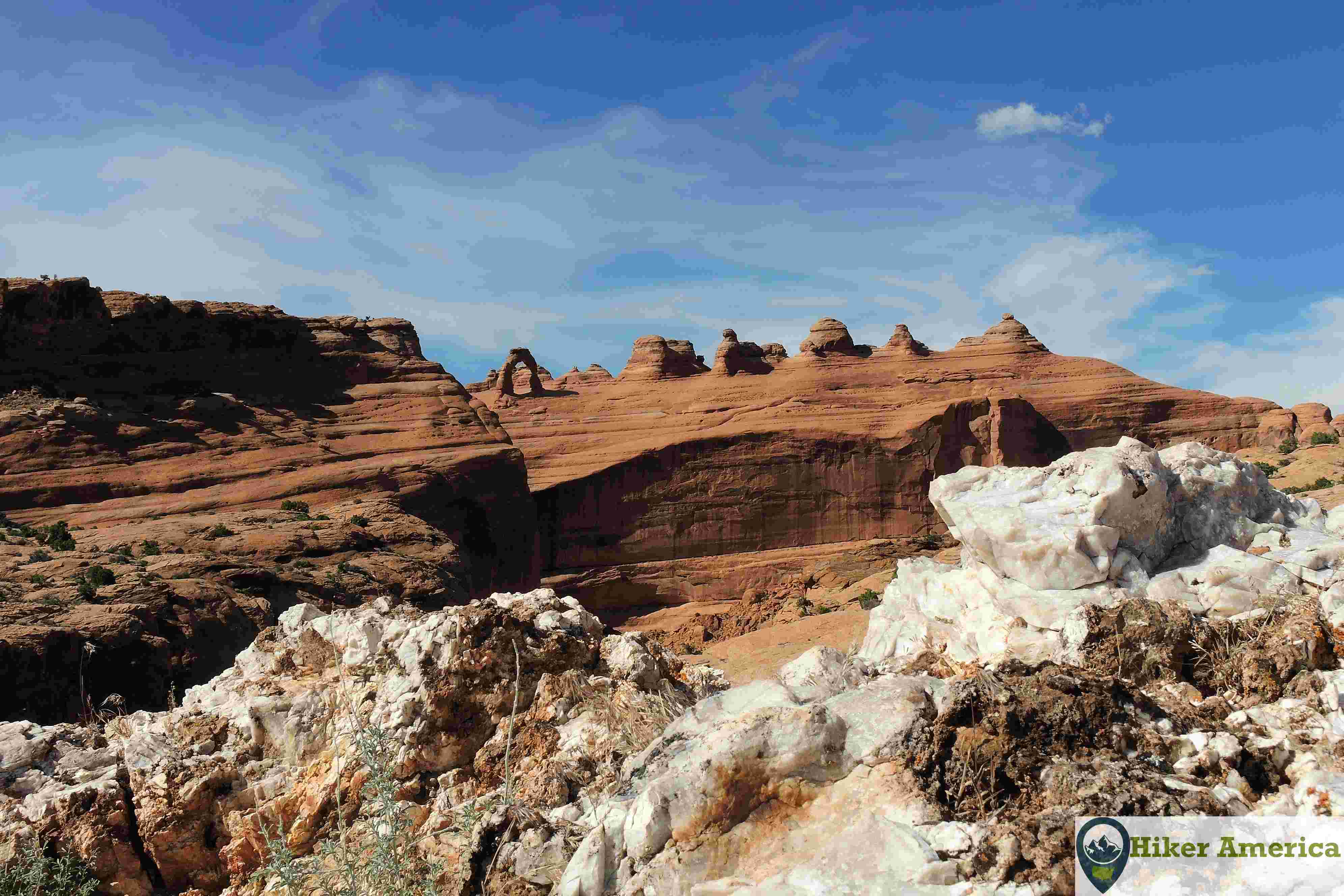 A unique white rock with Delicate Arch.